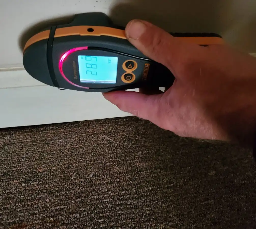 Moisture detection at baseboard during Storm Damage Restoration in Denville